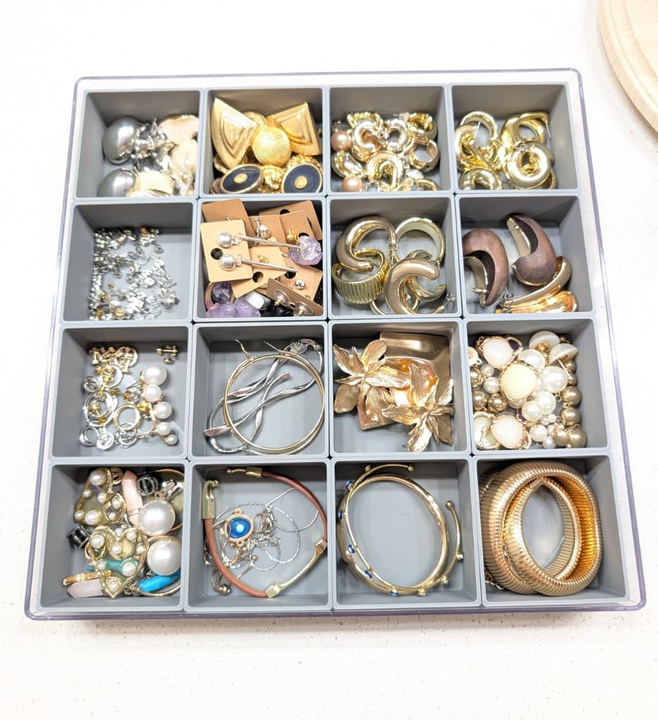Custom getGridded jewelry organizer tray with a grid of earrings and bracelets